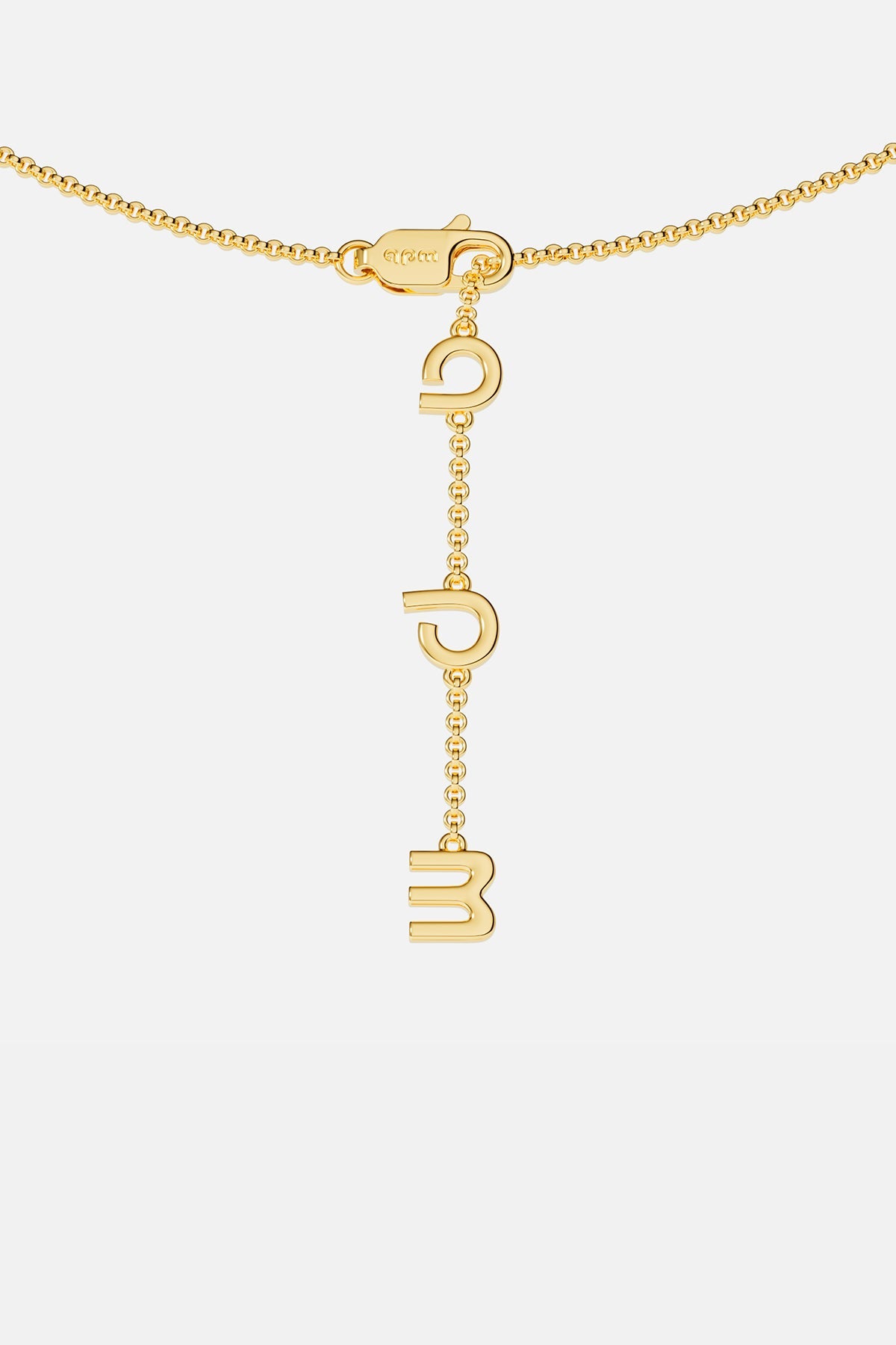 Gold necklace closing on a white background