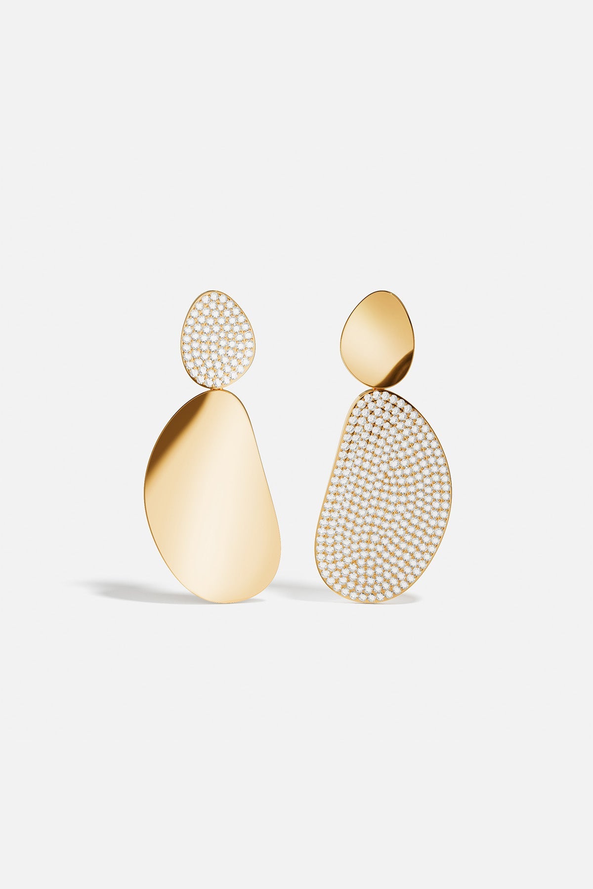 Earrings APM Monaco: Galet pair in yellow gold, one plain and one pavé with white stones.